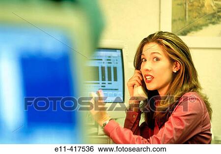 Woman talks on phone in office. View Large Photo Image Stock Photograph - Woman talks on phone in office.. Fotosearch