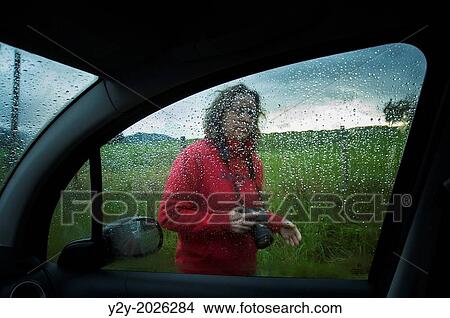 Woman through the window, raining. View Large Photo Image Picture - Woman through the window, raining.. Fotosearch