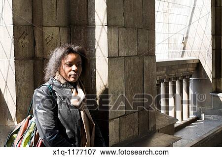 Stock Photo - Woman traveller on the viewing terrace at The Palace of Culture and Science, Warsaw Poland. Fotosearch