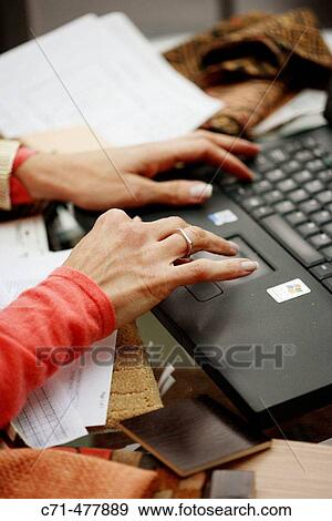 Woman typing on laptop View Large Photo Image Stock Photo - Woman typing on laptop. Fotosearch