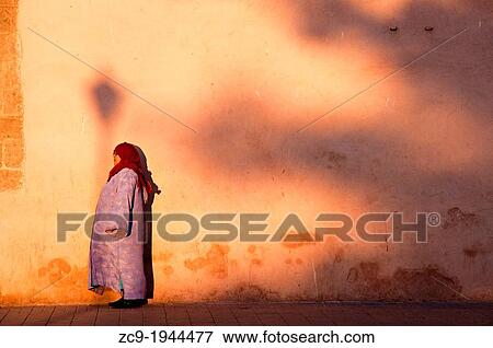 Woman under sunset lighting. Essaouira port, Morocco. View Large Photo Image Stock Photo - Woman under sunset lighting. Essaouira port, Morocco.. Fotosearch