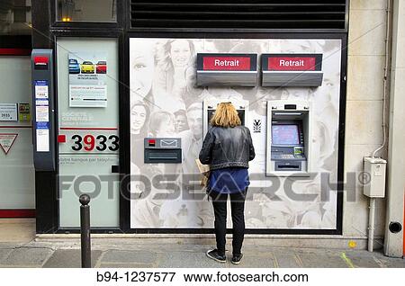 Woman using ATM, Paris, France View Large Photo Image Stock Photo - Woman using ATM, Paris, France. Fotosearch