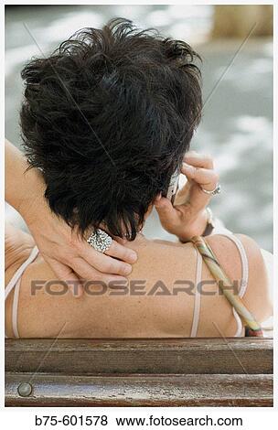 Woman using cell phone View Large Photo Image Stock Photo - Woman using cell phone. Fotosearch