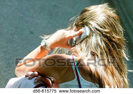 Woman using cell phone View Large Photo Image Stock Photography - Woman using cell phone. Fotosearch