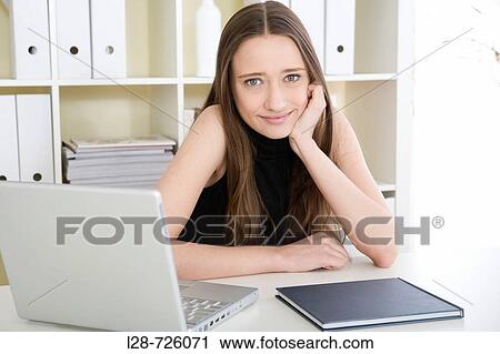 Stock Image - woman using computer. Fotosearch