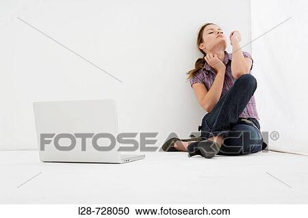 Stock Image - woman using computer. Fotosearch