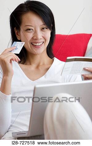 Woman using credit card View Large Photo Image Stock Photo - Woman using credit card. Fotosearch