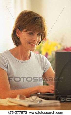 woman using her laptop View Large Photo Image Stock Image - woman using her laptop. Fotosearch