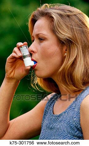 woman using inhaler View Large Photo Image Stock Photograph - woman using inhaler. Fotosearch