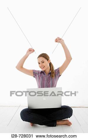 Stock Image - woman using laptop. Fotosearch