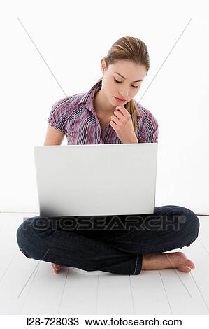 Stock Image - woman using laptop. Fotosearch