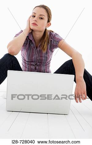 Stock Image - woman using laptop. Fotosearch