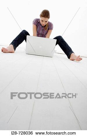 Stock Photograph - woman using laptop. Fotosearch
