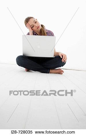 Stock Photography - woman using laptop. Fotosearch