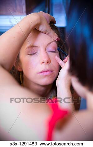 Woman using make-up brush on young woman in bathroom View Large Photo Image Stock Image - Woman using make-up brush on young woman in bathroom. Fotosearch