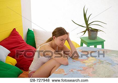 Stock Photo - woman using map. Fotosearch