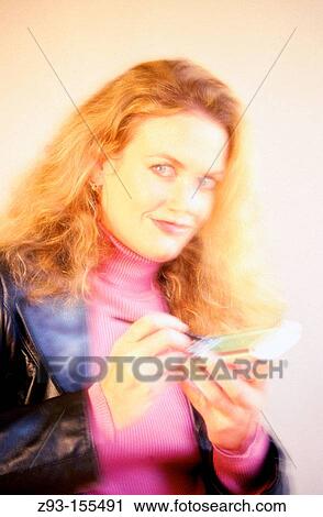Woman using PDA View Large Photo Image Stock Image - Woman using PDA. Fotosearch