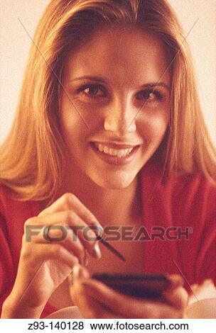 Stock Photo - Woman using PDA. Fotosearch