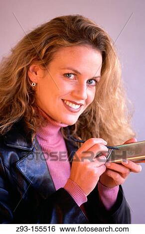 Woman using PDA View Large Photo Image Stock Photograph - Woman using PDA. Fotosearch
