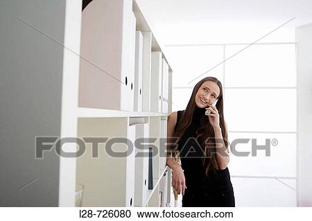 Stock Image - woman using phone. Fotosearch