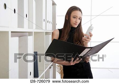 Stock Photo - woman using phone. Fotosearch