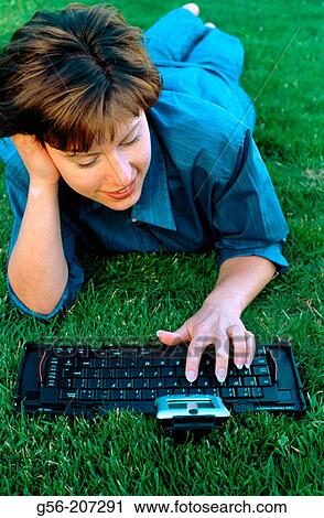 Woman using pocket organizer View Large Photo Image Stock Image - Woman using pocket organizer. Fotosearch