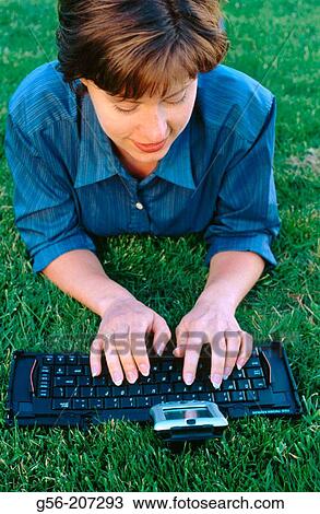 Woman using pocket organizerr View Large Photo Image Stock Image - Woman using pocket organizerr. Fotosearch