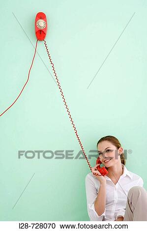 Woman using telephone View Large Photo Image Stock Image - Woman using telephone. Fotosearch