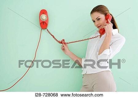 Woman using telephone View Large Photo Image Stock Photo - Woman using telephone. Fotosearch
