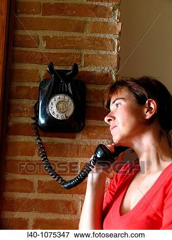Woman using telephone View Large Photo Image Stock Photo - Woman using telephone. Fotosearch