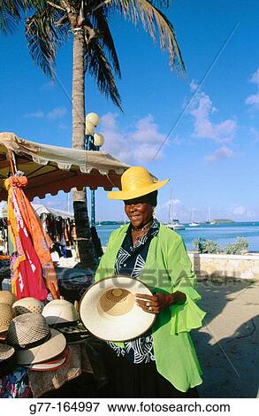 Woman vendor at market. Marigot. Saint Martin. Department of Guadeloupe (France) View Large Photo Image Stock Photo - Woman vendor at market. Marigot. Saint Martin. Department of Guadeloupe (France). Fotosearch