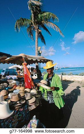 Woman vendor at market. Marigot. Saint Martin. Department of Guadeloupe (France) View Large Photo Image Stock Photo - Woman vendor at market. Marigot. Saint Martin. Department of Guadeloupe (France). Fotosearch
