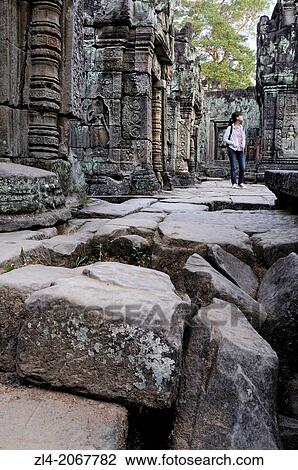 Woman visting Preah Khan temple. Cambodia, Siem Reap, Angkor. Model Released. (/Julien Garcia). View Large Photo Image Stock Image - Woman visting Preah Khan temple. Cambodia, Siem Reap, Angkor. Model Released. (/Julien Garcia).. Fotosearch