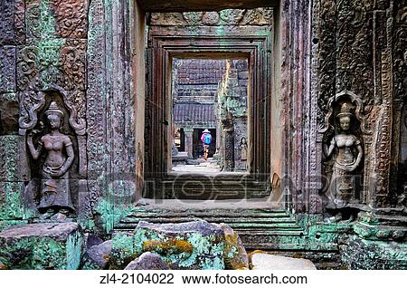Stock Image - Woman visting Preah Khan temple. Cambodia, Siem Reap, Angkor.. Fotosearch