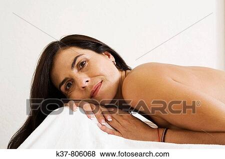 Stock Photo - Woman waiting for acupuncture therapy. Fotosearch