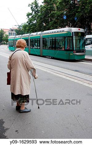 Woman waits for the tram, Helsinki, Uusimaa, Finland View Large Photo Image Stock Image - Woman waits for the tram, Helsinki, Uusimaa, Finland. Fotosearch