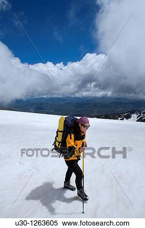 Stock Photography - Woman walking along the border between Sierra de B? jar Natural Park, in Salamanca province, and Sierra de Gredos Regional Park, in? vila province. Fotosearch