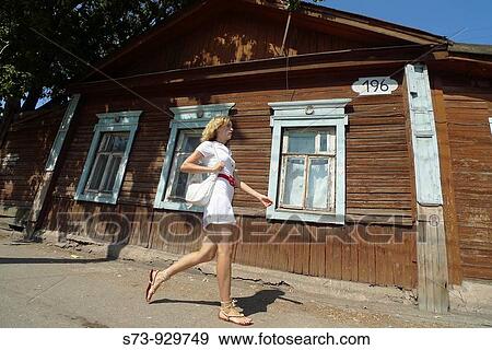 Woman walking in a Samara street, Samara Region, Russian Federation, Russia View Large Photo Image Stock Photo - Woman walking in a Samara street, Samara Region, Russian Federation, Russia. Fotosearch