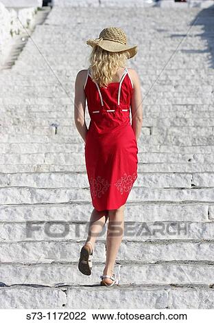 Woman walking in Mykonos, Greek Islands, Greece View Large Photo Image Stock Image - Woman walking in Mykonos, Greek Islands, Greece. Fotosearch