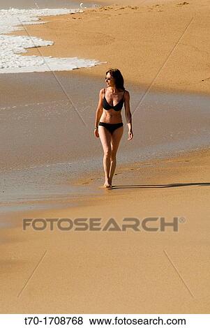 Woman walking on Punta de Tralca beach, Chile. View Large Photo Image Stock Photo - Woman walking on Punta de Tralca beach, Chile.. Fotosearch