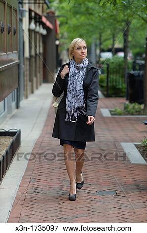 Woman walking on suburban sidewalk, Rockville Maryland View Large Photo Image Stock Photo - Woman walking on suburban sidewalk, Rockville Maryland. Fotosearch