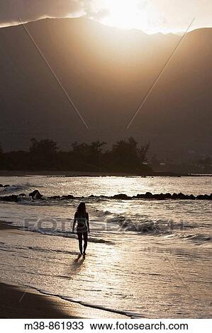 Woman walking on the beach Maui, Hawaii View Large Photo Image Stock Image - Woman walking on the beach Maui, Hawaii. Fotosearch