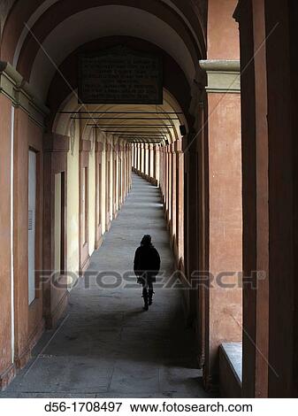 Woman walking under arcade, Bologna, Italy View Large Photo Image Stock Photo - Woman walking under arcade, Bologna, Italy. Fotosearch