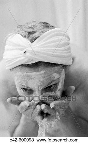 Stock Photo - Woman washing her face. Fotosearch