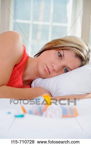 woman watching her pills View Large Photo Image Stock Photo - woman watching her pills. Fotosearch
