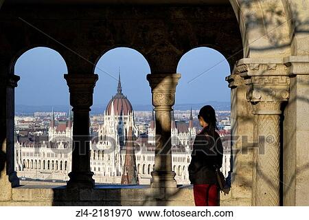 Woman watching the Hungarian Parliament Building from the Fisherman's Bastion. Hungary, Budapest. Model Released. View Large Photo Image Stock Image - Woman watching the Hungarian Parliament Building from the Fisherman's Bastion. Hungary, Budapest. Model Released.. Fotosearch