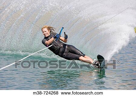 Woman waterskiing, Bellevue, Idaho, USA. View Large Photo Image Stock Photo - Woman waterskiing, Bellevue, Idaho, USA.. Fotosearch