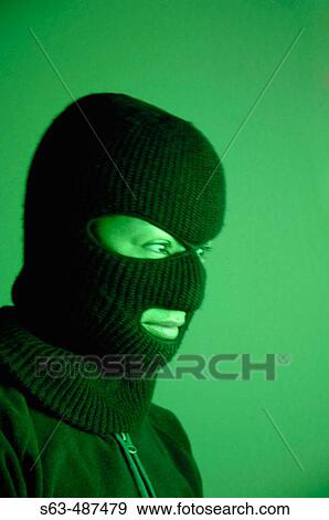 Stock Photo - Woman wearing balaclava. Fotosearch
