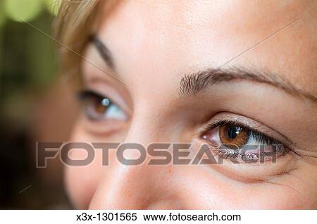 Woman wearing brown contact lenses View Large Photo Image Stock Photography - Woman wearing brown contact lenses. Fotosearch