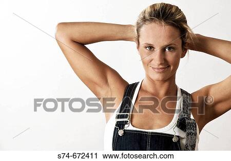 Woman wearing jean overalls. View Large Photo Image Stock Image - Woman wearing jean overalls.. Fotosearch